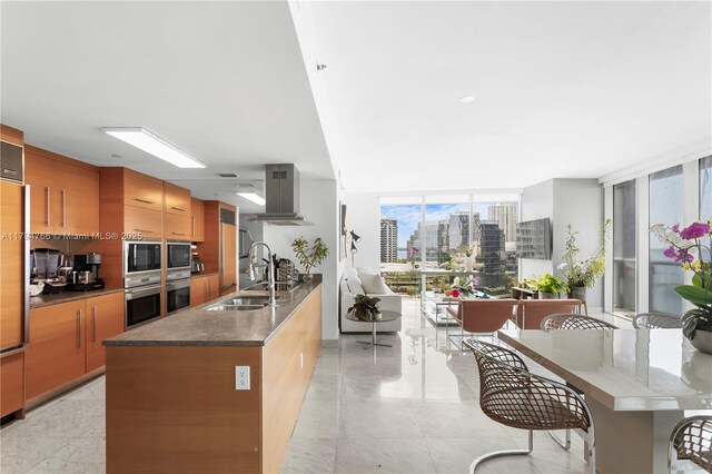 495 Brickell Ave Unit 1001, Miami, FL 33131 - kitchen with extractor fan, a sink, a city view, built in microwave, and modern cabinets