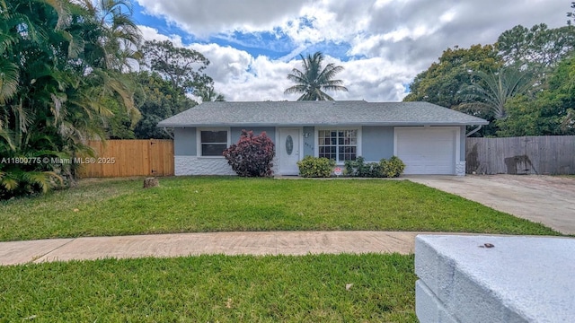 4878 Messana Ter, Lake Worth, FL 33463 - view of front of house featuring an attached garage, concrete driveway, and stucco siding