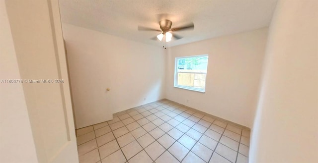 4878 Messana Ter, Lake Worth, FL 33463 - empty room featuring ceiling fan and light tile patterned floors