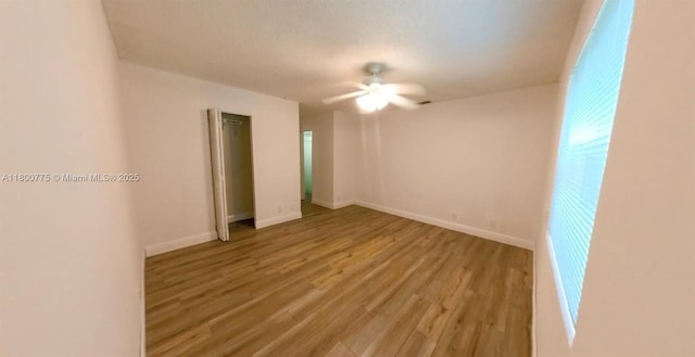 4878 Messana Ter, Lake Worth, FL 33463 - spare room with wood finished floors, ceiling fan, and baseboards