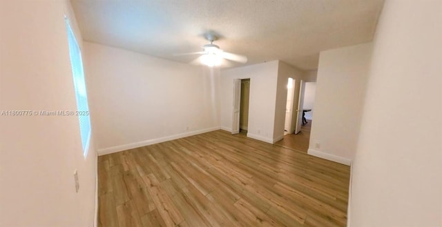 4878 Messana Ter, Lake Worth, FL 33463 - unfurnished room featuring light wood finished floors, a ceiling fan, and baseboards