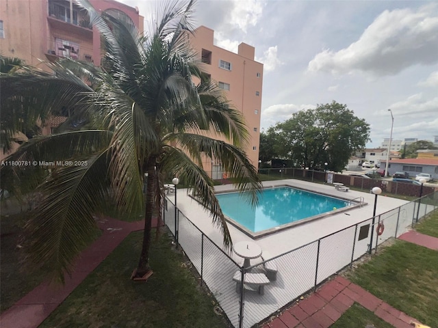 community pool featuring fence