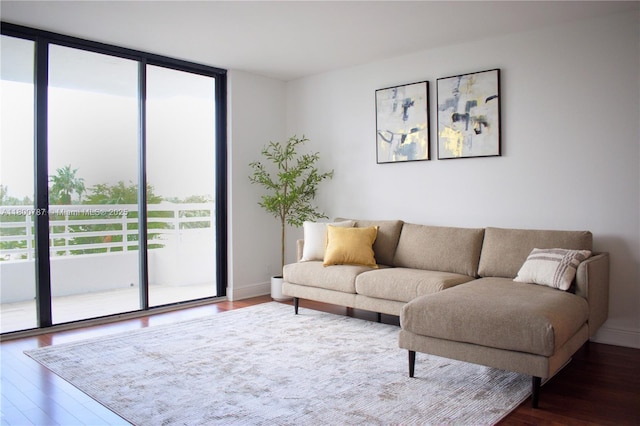 3300 NE 192nd St Unit 611, Aventura, FL 33180 - living room featuring healthy amount of natural light, wood finished floors, and floor to ceiling windows