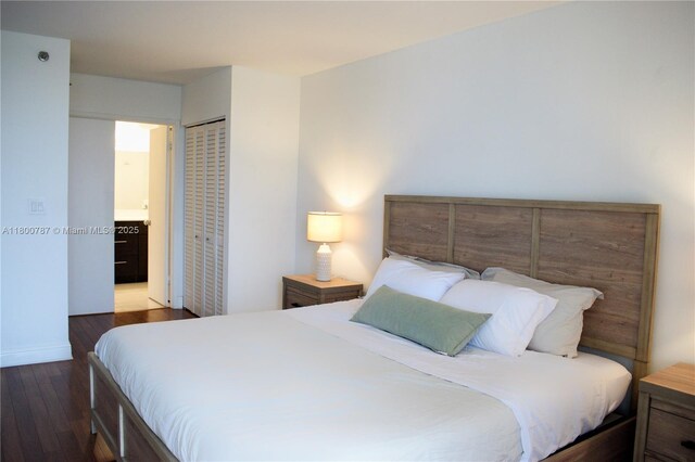 3300 NE 192nd St Unit 611, Aventura, FL 33180 - bedroom featuring wood finished floors, a closet, and baseboards
