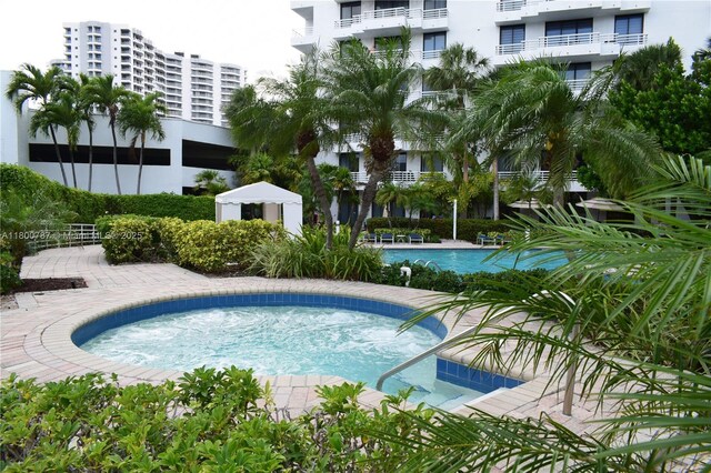 3300 NE 192nd St Unit 611, Aventura, FL 33180 - community pool featuring a community hot tub