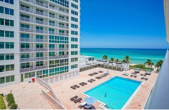 5401 Collins Ave Unit 428, Miami Beach, FL 33140 - community pool with a water view and a patio