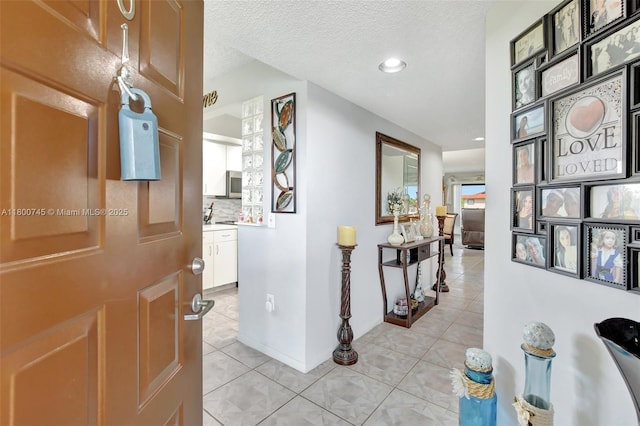 1500 SW 131st Way Unit 401N, Pembroke Pines, FL 33027 - hall with light tile patterned floors, recessed lighting, and a textured ceiling