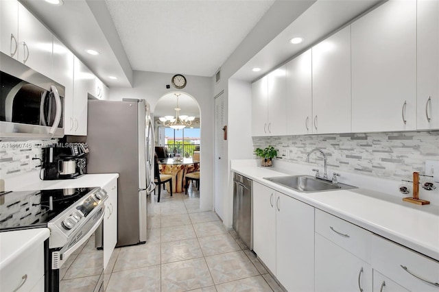 1500 SW 131st Way Unit 401N, Pembroke Pines, FL 33027 - kitchen with appliances with stainless steel finishes, a sink, a chandelier, recessed lighting, and decorative backsplash