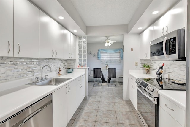 1500 SW 131st Way Unit 401N, Pembroke Pines, FL 33027 - kitchen featuring stainless steel appliances, a sink, recessed lighting, backsplash, and light countertops