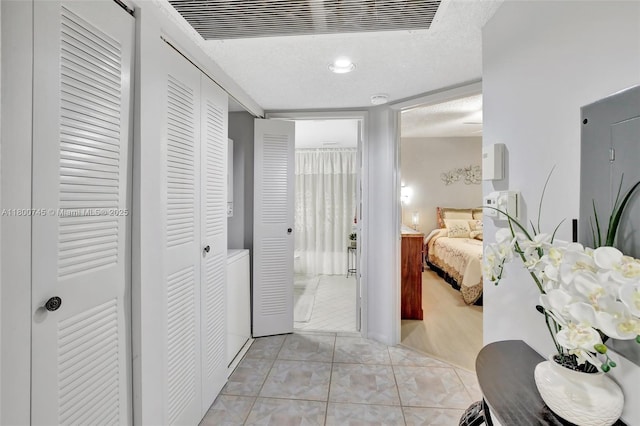 1500 SW 131st Way Unit 401N, Pembroke Pines, FL 33027 - hallway with light tile patterned floors and a textured ceiling