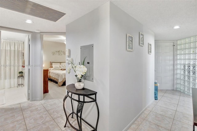 1500 SW 131st Way Unit 401N, Pembroke Pines, FL 33027 - hall featuring electric panel, light tile patterned flooring, a textured ceiling, and recessed lighting