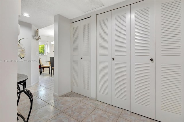 1500 SW 131st Way Unit 401N, Pembroke Pines, FL 33027 - corridor featuring light marble finish floors and baseboards