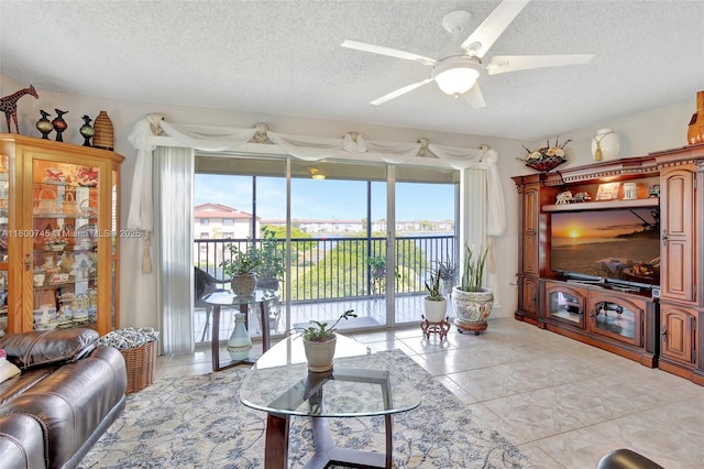 1500 SW 131st Way Unit 401N, Pembroke Pines, FL 33027 - living area featuring a textured ceiling, ceiling fan, and light tile patterned floors