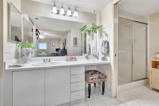 1500 SW 131st Way Unit 401N, Pembroke Pines, FL 33027 - full bathroom with ensuite bath, a stall shower, tile patterned floors, vanity, and a textured ceiling