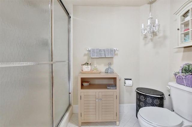 1500 SW 131st Way Unit 401N, Pembroke Pines, FL 33027 - bathroom with an enclosed shower, toilet, tile patterned flooring, and a chandelier
