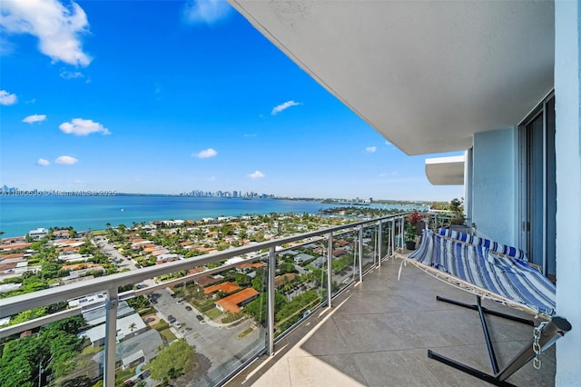 balcony featuring a water view