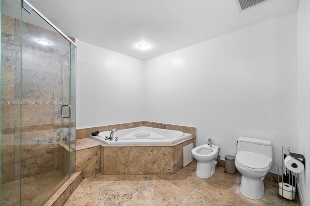full bathroom featuring a bidet, toilet, a garden tub, and a stall shower
