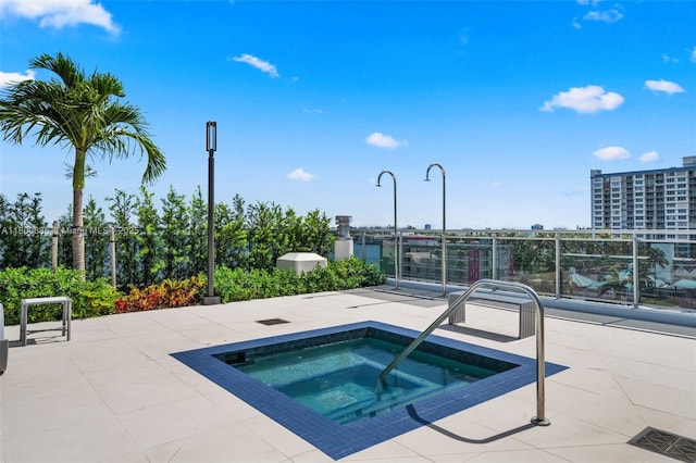 view of swimming pool featuring a community hot tub