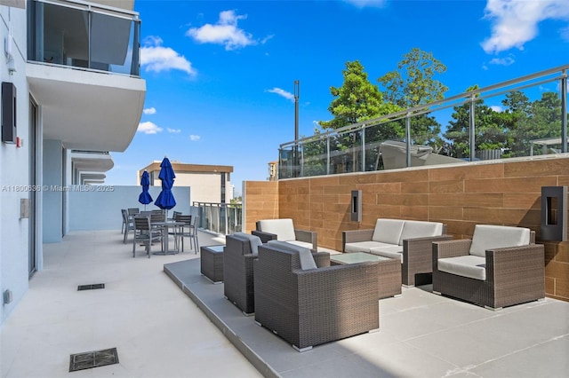 view of patio featuring outdoor lounge area and outdoor dining space