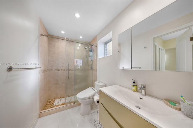 bathroom featuring a stall shower, toilet, vanity, and recessed lighting