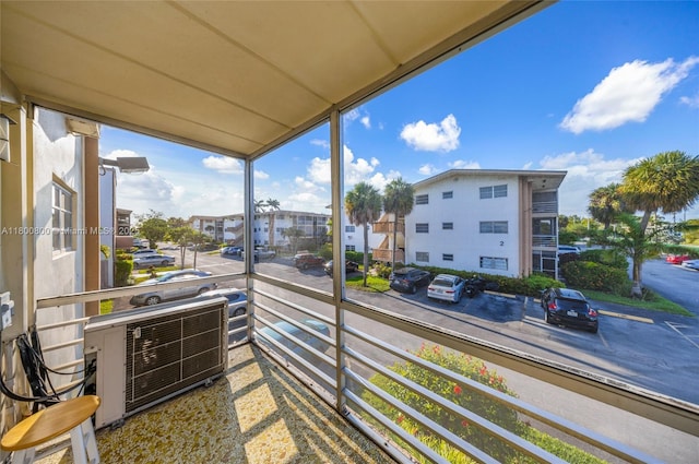balcony featuring a residential view and central air condition unit