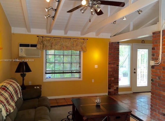 tiled living room featuring healthy amount of natural light, a wall mounted air conditioner, ceiling fan, and baseboards