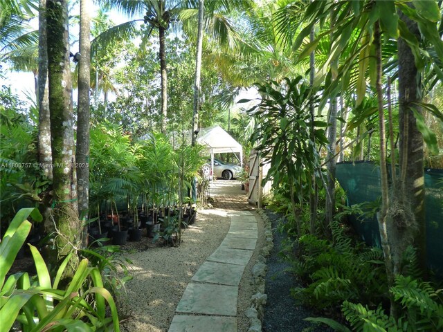 5858 SW 80th St, South Miami, FL 33143 - bedroom featuring brick floors and multiple windows