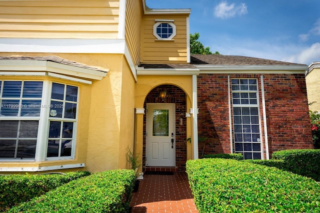 12840 SW 146th Ln, Miami, FL 33186 - view of exterior entry featuring stucco siding and brick siding
