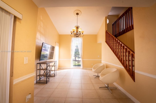 12840 SW 146th Ln, Miami, FL 33186 - interior space featuring a chandelier, lofted ceiling, baseboards, and tile patterned floors