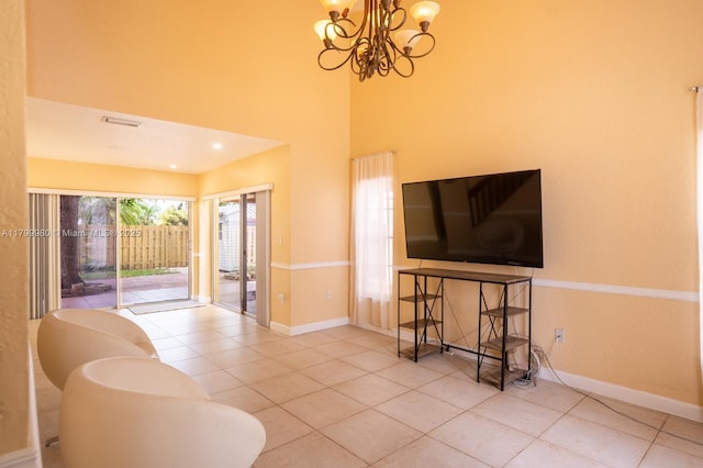 12840 SW 146th Ln, Miami, FL 33186 - living area with tile patterned floors, a chandelier, baseboards, and a high ceiling