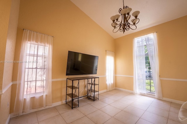 12840 SW 146th Ln, Miami, FL 33186 - spare room featuring vaulted ceiling, a chandelier, tile patterned flooring, and baseboards