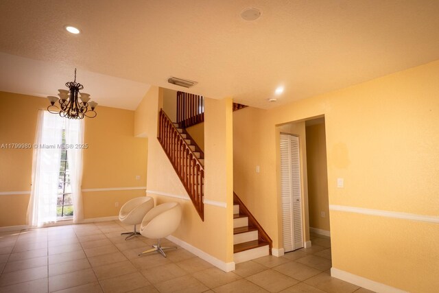 12840 SW 146th Ln, Miami, FL 33186 - staircase featuring baseboards, tile patterned flooring, a chandelier, and recessed lighting