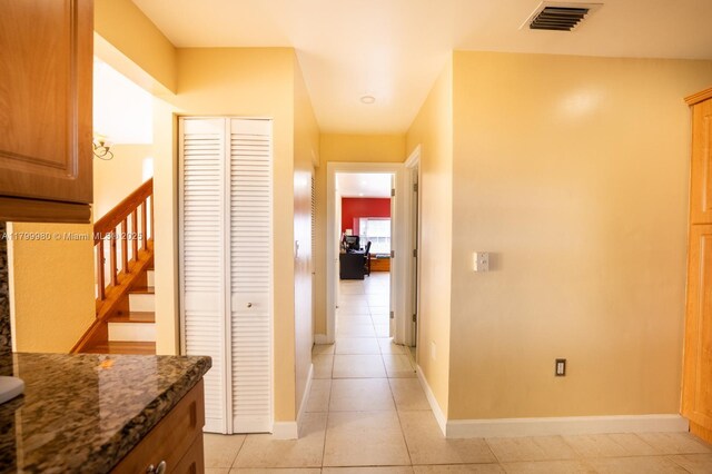 12840 SW 146th Ln, Miami, FL 33186 - hall featuring baseboards, light tile patterned flooring, and stairway