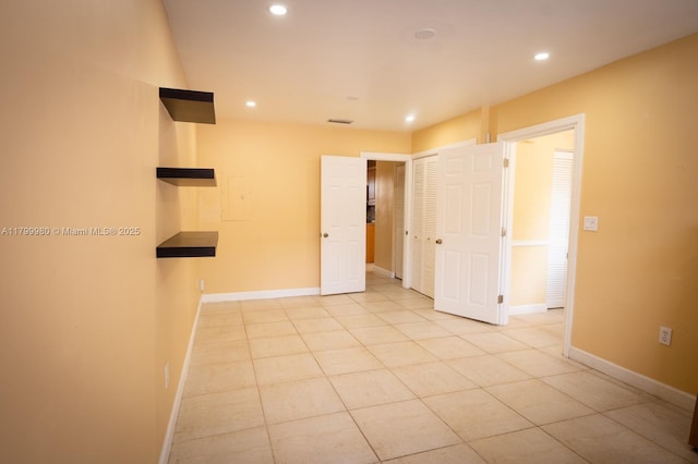 12840 SW 146th Ln, Miami, FL 33186 - spare room featuring recessed lighting, light tile patterned floors, and baseboards