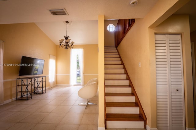12840 SW 146th Ln, Miami, FL 33186 - stairs with vaulted ceiling, a chandelier, and baseboards