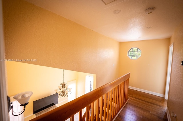 12840 SW 146th Ln, Miami, FL 33186 - hallway with hardwood / wood-style floors, an upstairs landing, baseboards, and a textured wall