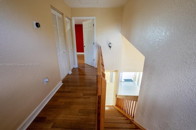 12840 SW 146th Ln, Miami, FL 33186 - hallway featuring wood finished floors, baseboards, and a textured wall