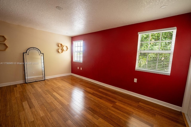 12840 SW 146th Ln, Miami, FL 33186 - unfurnished room featuring wood finished floors, a textured ceiling, and baseboards