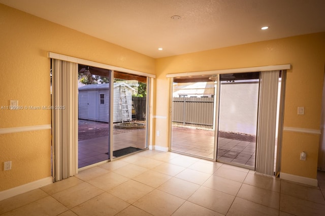 12840 SW 146th Ln, Miami, FL 33186 - tiled spare room with a textured wall, baseboards, and recessed lighting