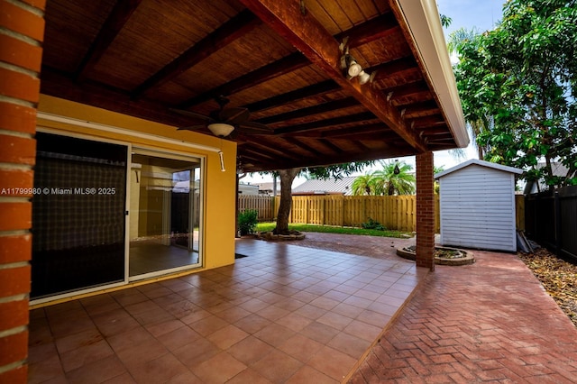12840 SW 146th Ln, Miami, FL 33186 - view of patio with a ceiling fan, a shed, an outbuilding, and a fenced backyard