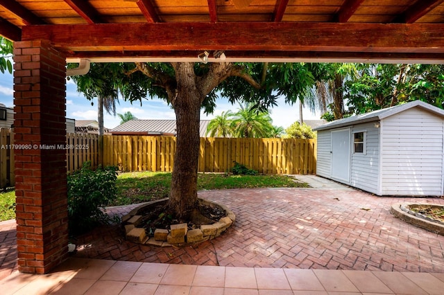 12840 SW 146th Ln, Miami, FL 33186 - view of patio / terrace with an outbuilding and a fenced backyard