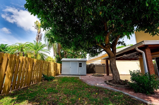 12840 SW 146th Ln, Miami, FL 33186 - fenced backyard with a shed, an outbuilding, and a patio
