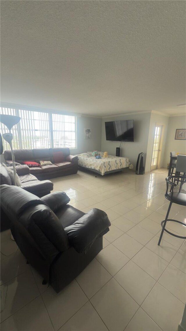 1351 NE Miami Gardens Dr Unit 1225E, Miami, FL 33179 - living room featuring a textured ceiling and tile patterned floors