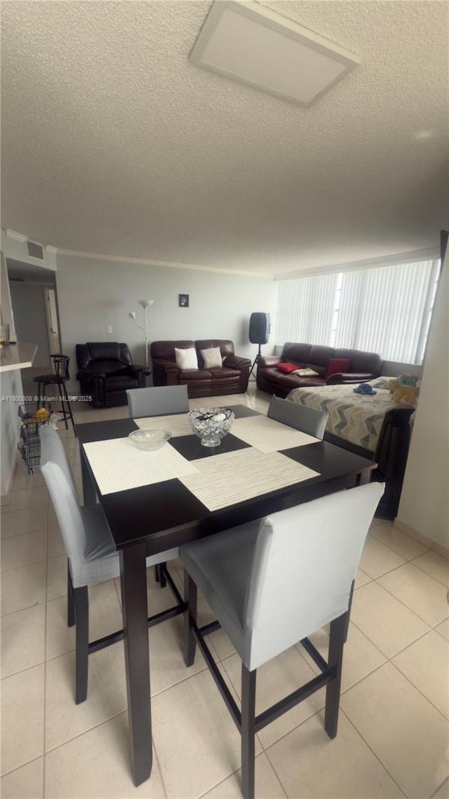 1351 NE Miami Gardens Dr Unit 1225E, Miami, FL 33179 - dining area featuring a textured ceiling and light tile patterned floors