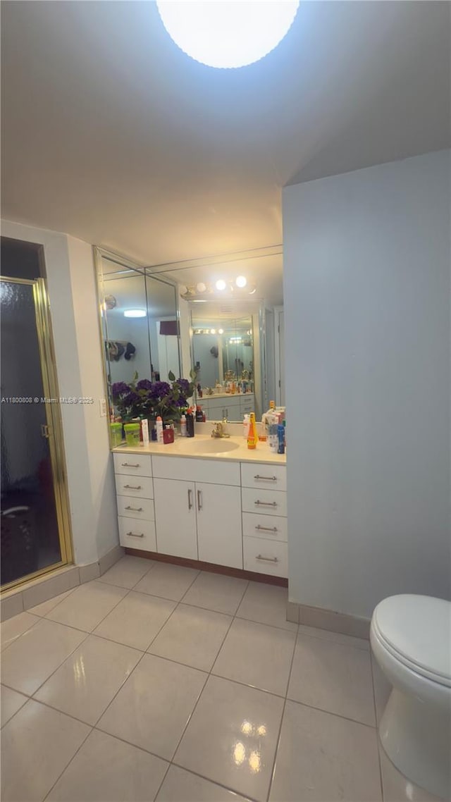 1351 NE Miami Gardens Dr Unit 1225E, Miami, FL 33179 - full bathroom featuring tile patterned floors, vanity, a stall shower, toilet, and baseboards