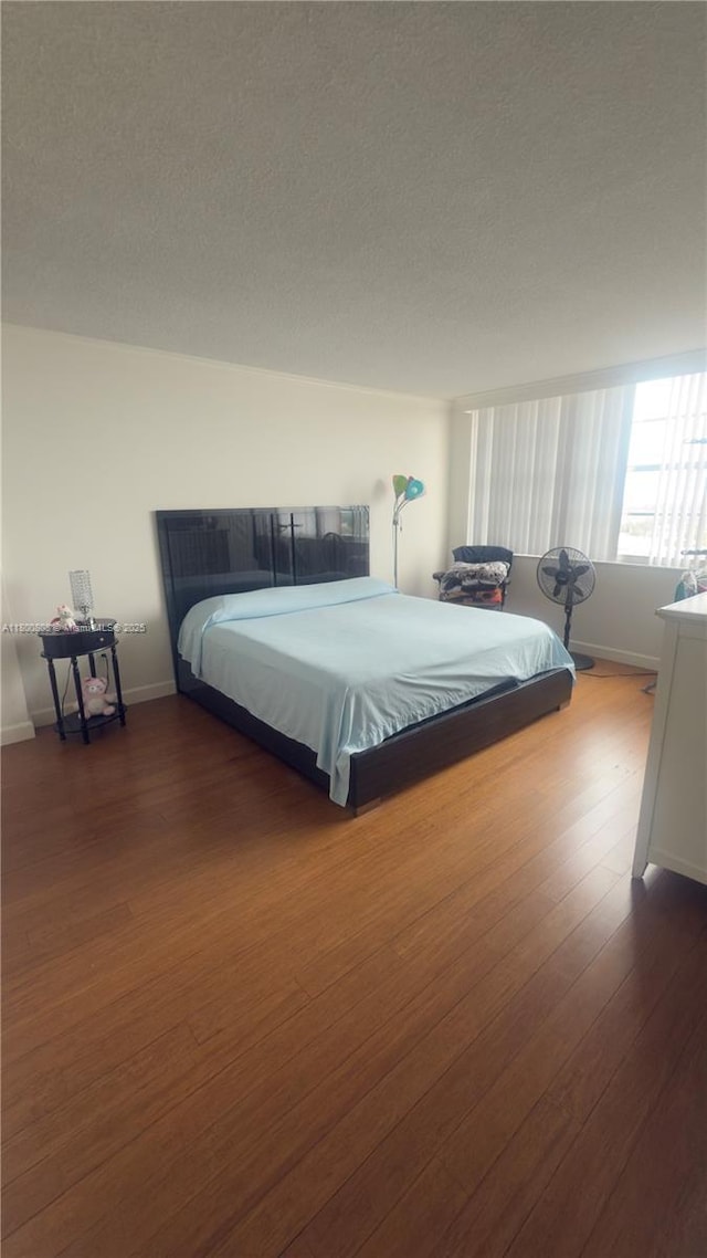 1351 NE Miami Gardens Dr Unit 1225E, Miami, FL 33179 - bedroom featuring wood finished floors and baseboards