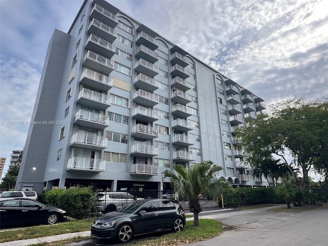 1470 NE 125th Ter Unit 810, North Miami, FL 33161 - view of apartment building / complex with fence