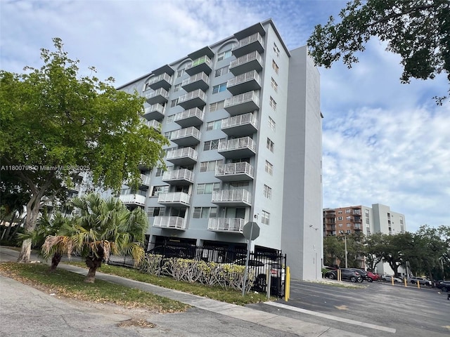 1470 NE 125th Ter Unit 810, North Miami, FL 33161 - view of apartment building / complex featuring uncovered parking