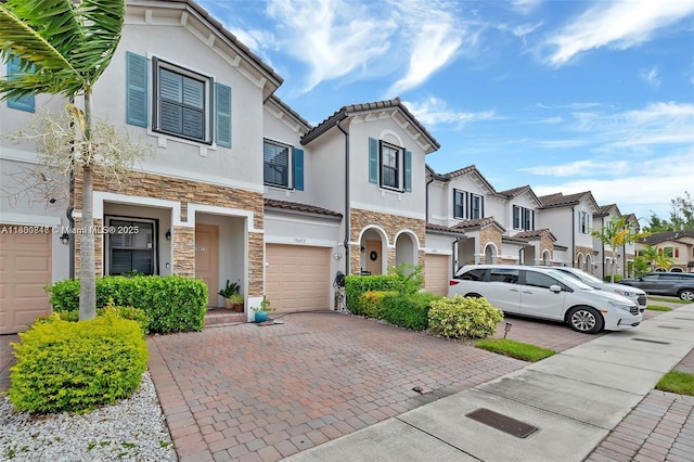 15073 SW 119th Ln, Miami, FL 33196 - multi unit property with stone siding, stucco siding, an attached garage, and driveway