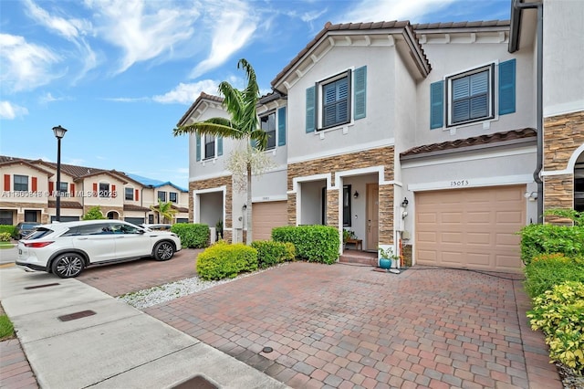 15073 SW 119th Ln, Miami, FL 33196 - multi unit property featuring stone siding, a garage, decorative driveway, and stucco siding